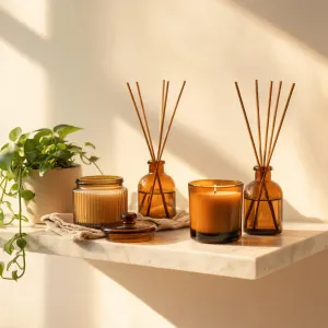 Amber candle vessels arranged for a seasonal gift edit